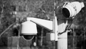 Surveillance camera mounted on a pole, representing a concept related to database monitoring.